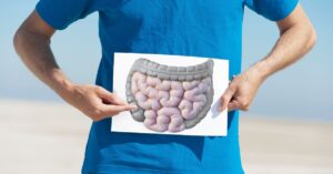 gut feeling, represented by a person holding an image of intestines over their gut